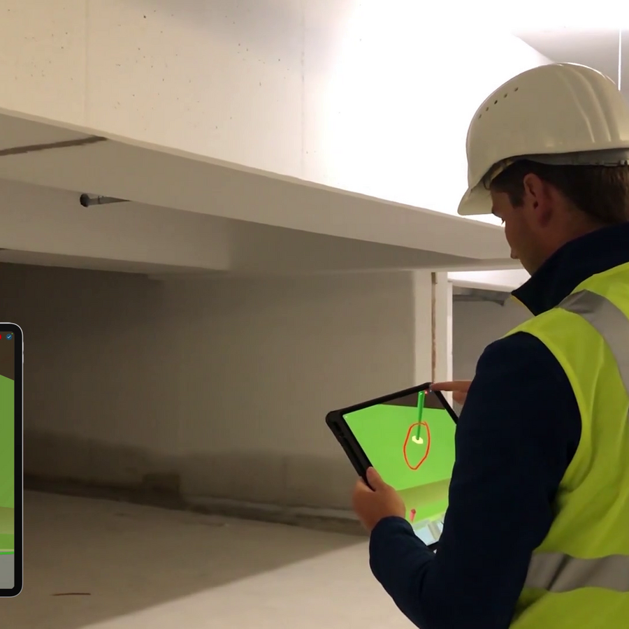 Employee with iPad on constuction site