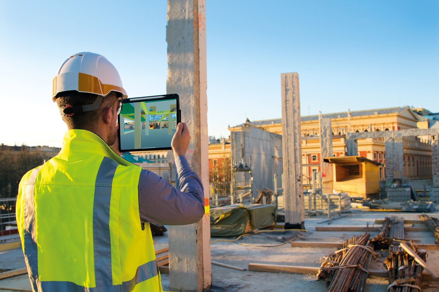 Wien Museum: employee with iPad on construction site